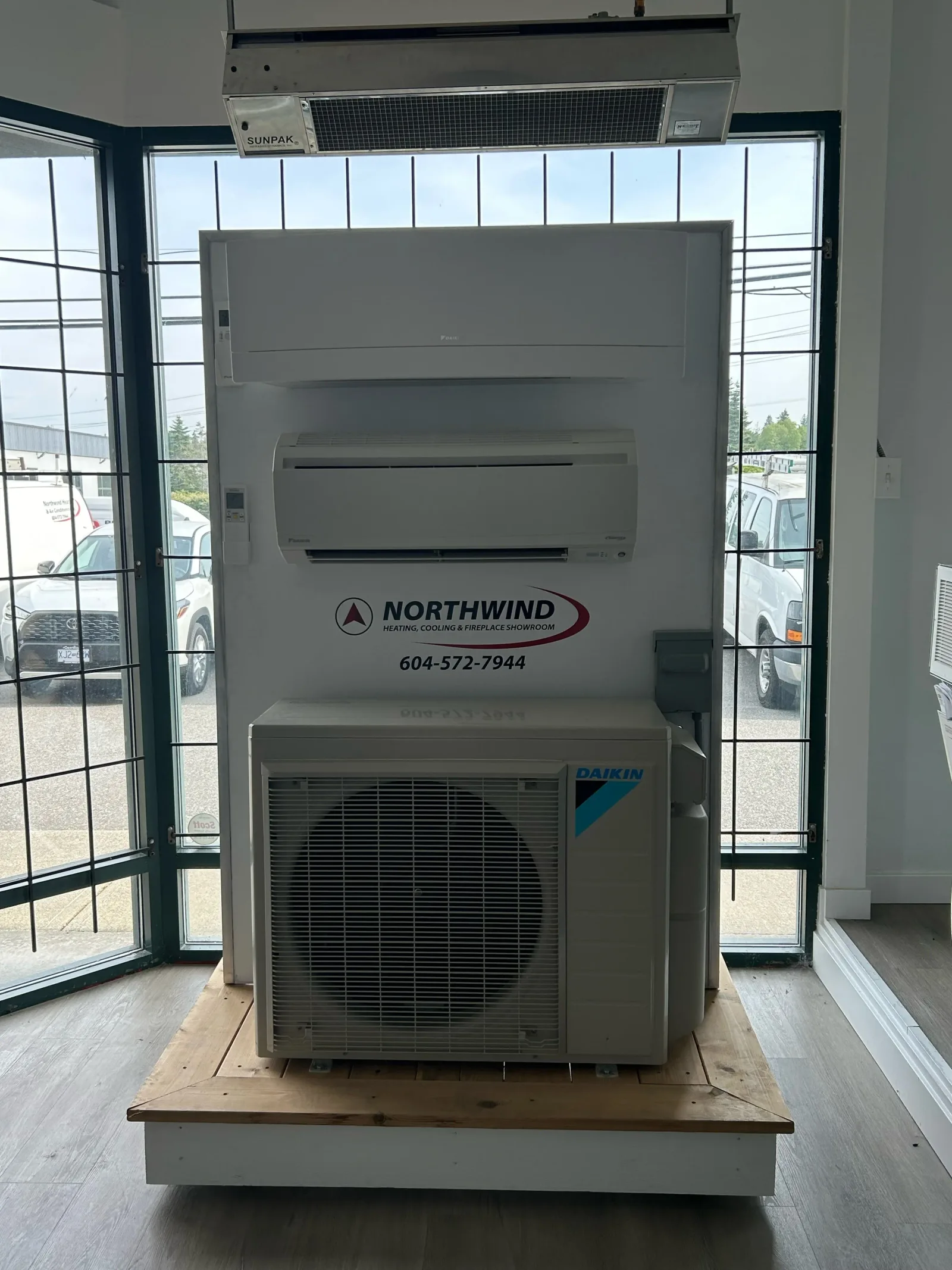 Ductless mini-split heads mounted on the display wall of the Northwind showroom